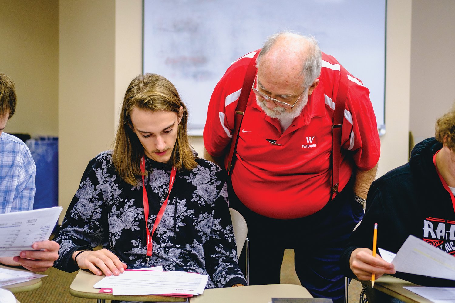 Wabash College Associate Professor of Religion David Blix, center, chats with a student during 2022 summer programming on campus in Crawfordsville.
